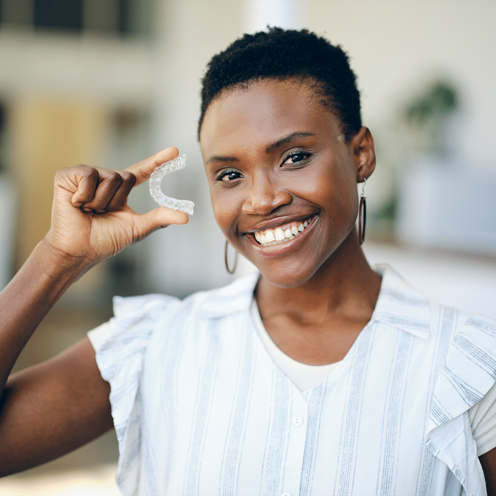 Invisalign and lady smiling